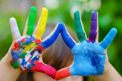 Child's hands painted in different bright colors ** Note: Slight blurriness, best at smaller sizes